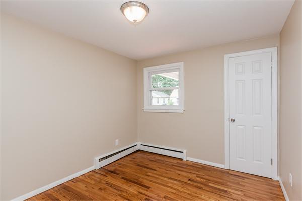 185 Redlands Street Springfield, MA 01104 - Photo 21 of 28 a view of empty room with wooden floor