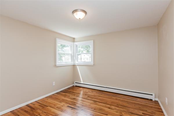 185 Redlands Street Springfield, MA 01104 - Photo 23 of 28 an empty room with wooden floor and windows