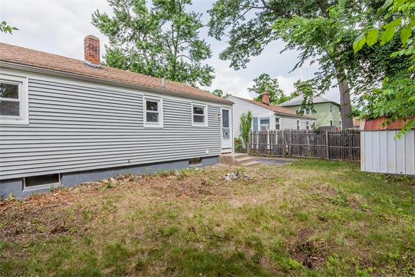 185 Redlands Street Springfield, MA 01104 - Photo 4 of 28 a view of a house with a backyard