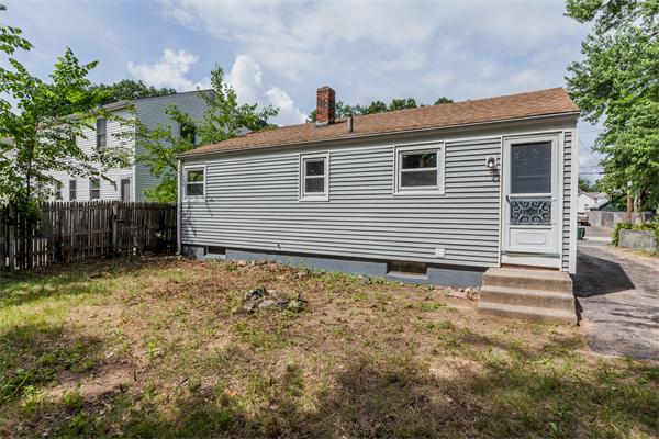 185 Redlands Street Springfield, MA 01104 - Photo 5 of 28 a view of a house with a yard