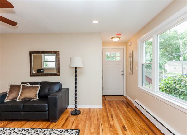 185 Redlands Street Springfield, MA 01104 - Photo 7 of 28 a living room with a couch and a table