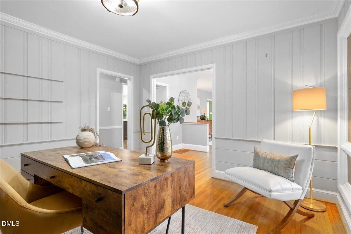 1401 Spring Forest Road Raleigh, NC 27615 - Photo 12 of 47 a view of a dining room with furniture and wooden floor