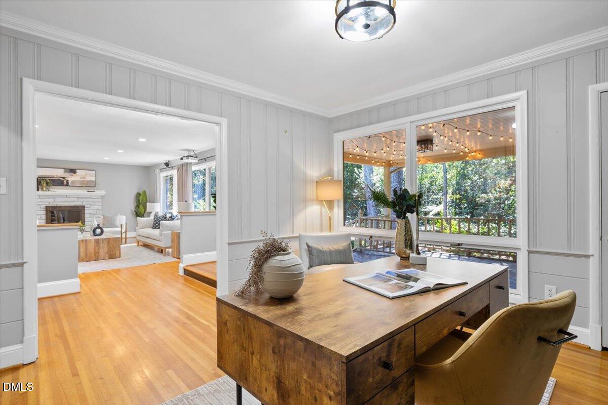 1401 Spring Forest Road Raleigh, NC 27615 - Photo 12 of 47 a living room with dining table and a large window