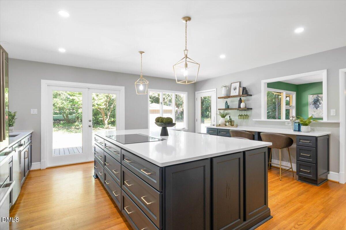 1401 Spring Forest Road Raleigh, NC 27615 - Photo 16 of 47 a kitchen with sink stove and refrigerator