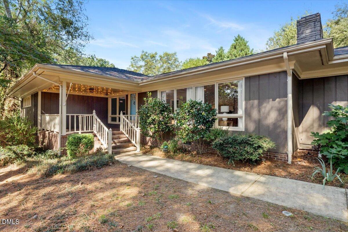 1401 Spring Forest Road Raleigh, NC 27615 - Photo 2 of 47 a front view of a house with garden