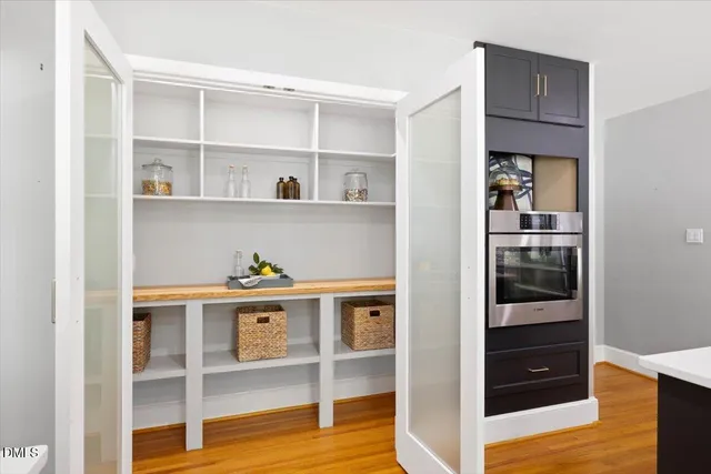a shelf with books and knick knacks on it