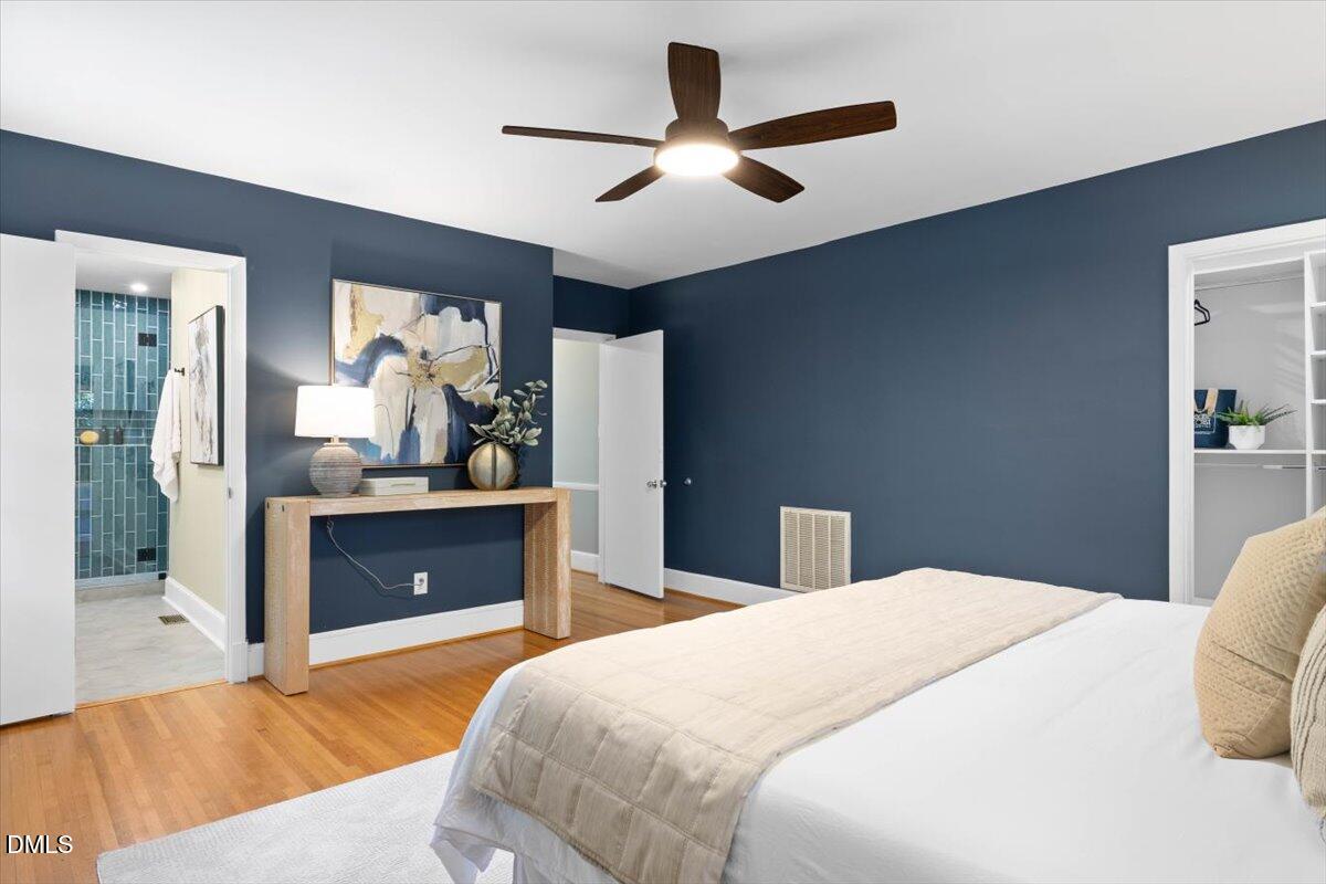 1401 Spring Forest Road Raleigh, NC 27615 - Photo 25 of 47 a bedroom with a bed and a view of en suite bathroom