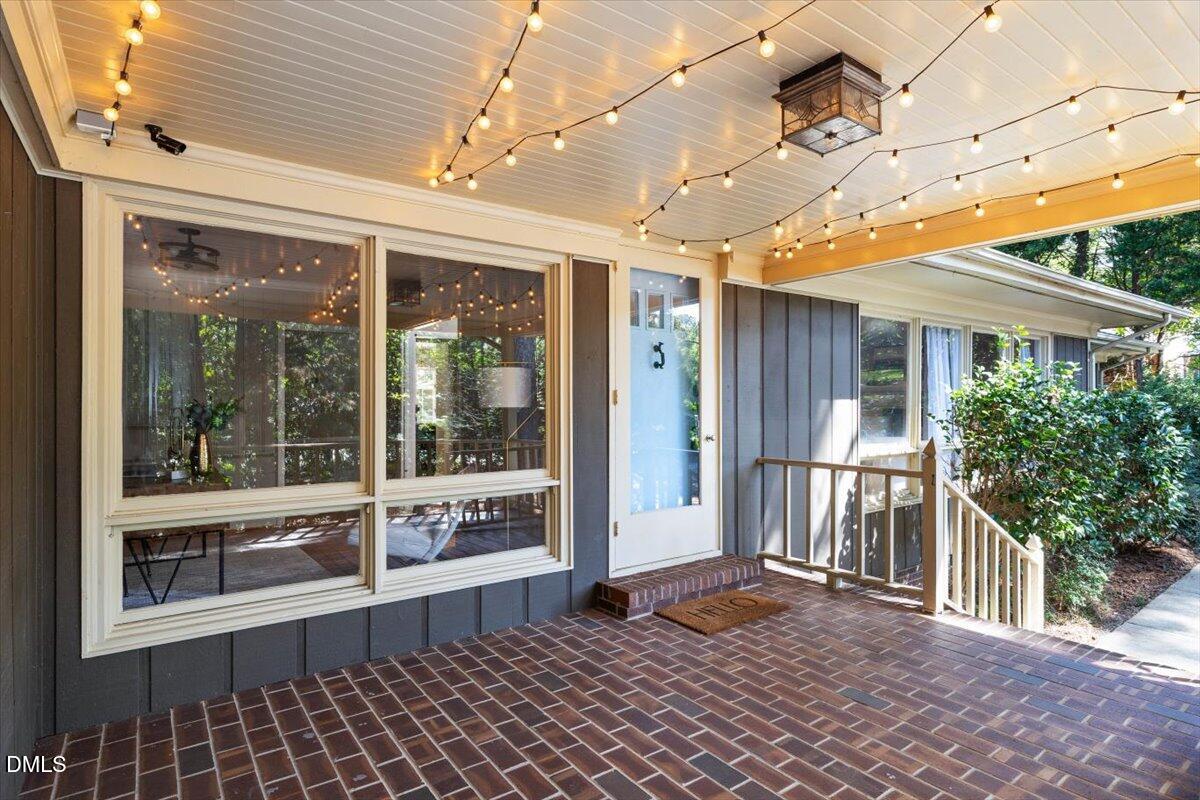 1401 Spring Forest Road Raleigh, NC 27615 - Photo 3 of 47 a view of a porch with a table and chairs