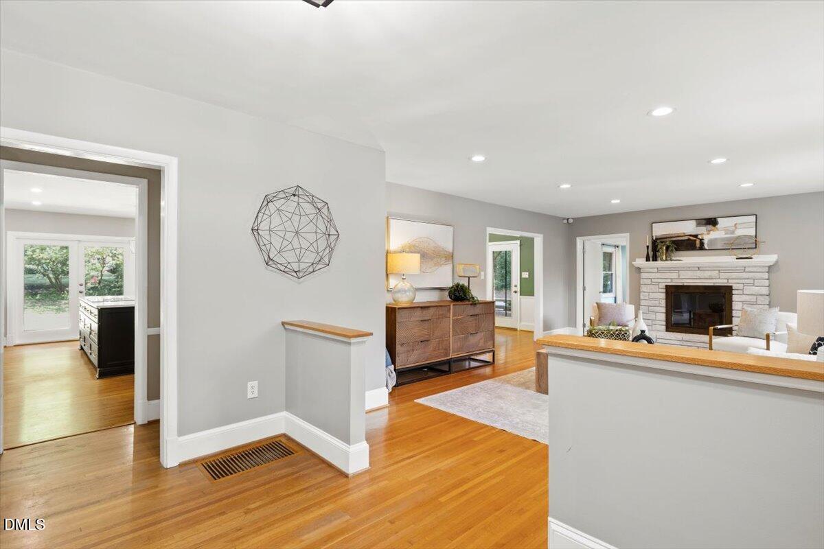 1401 Spring Forest Road Raleigh, NC 27615 - Photo 4 of 47 a living room with fireplace furniture and a flat screen tv