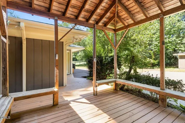 a balcony view with a seating space