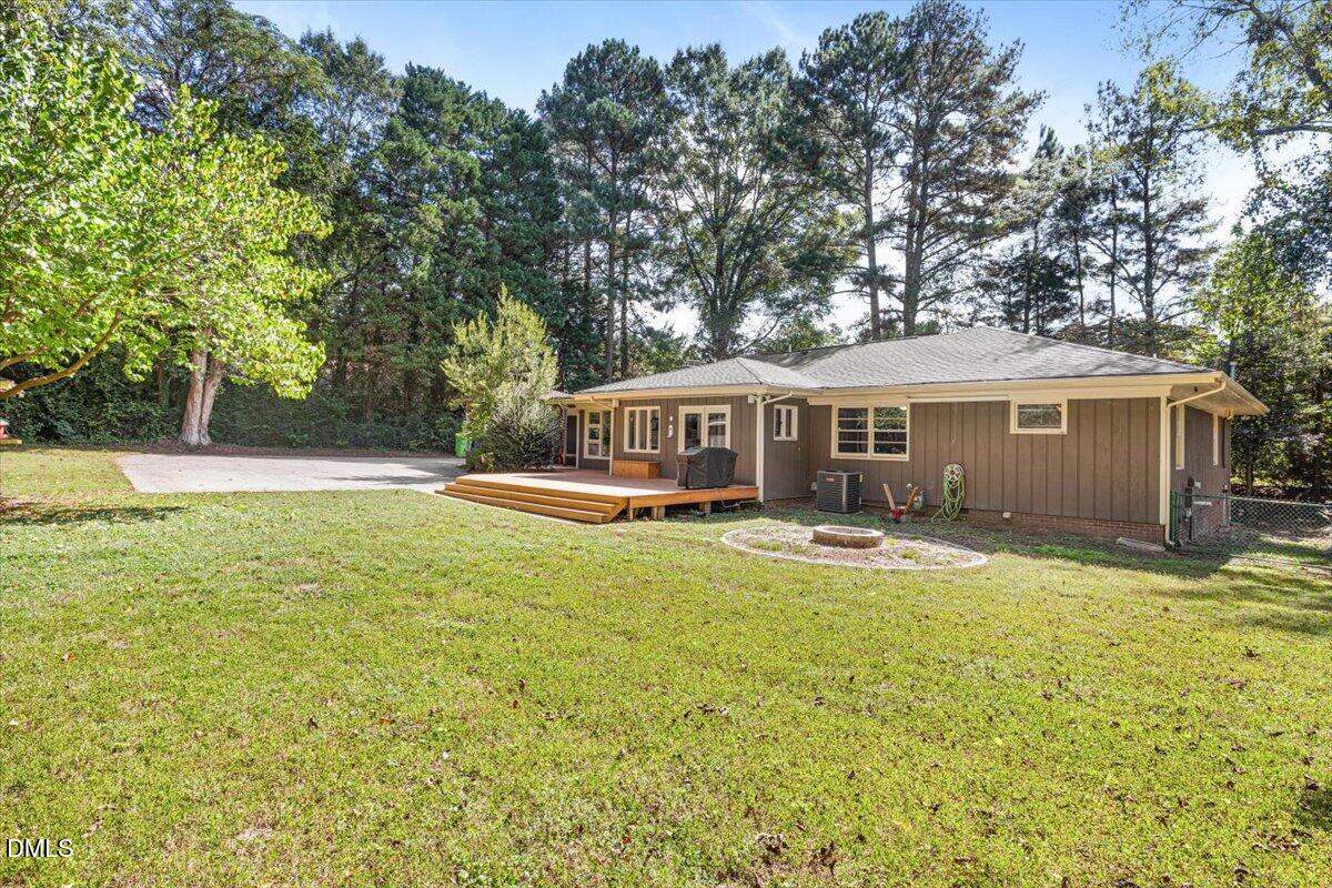 1401 Spring Forest Road Raleigh, NC 27615 - Photo 43 of 47 a view of a house with swimming pool and a yard