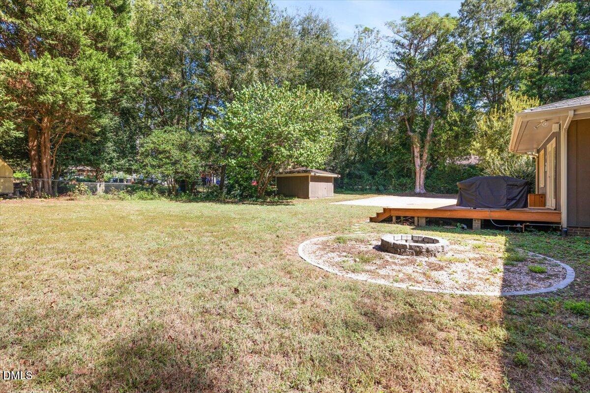 1401 Spring Forest Road Raleigh, NC 27615 - Photo 46 of 47 a backyard of a house with yard and outdoor seating