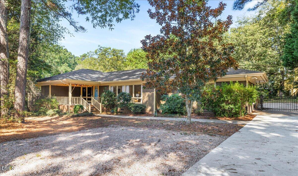 1401 Spring Forest Road Raleigh, NC 27615 - Photo 47 of 47 a front view of a house with a garden