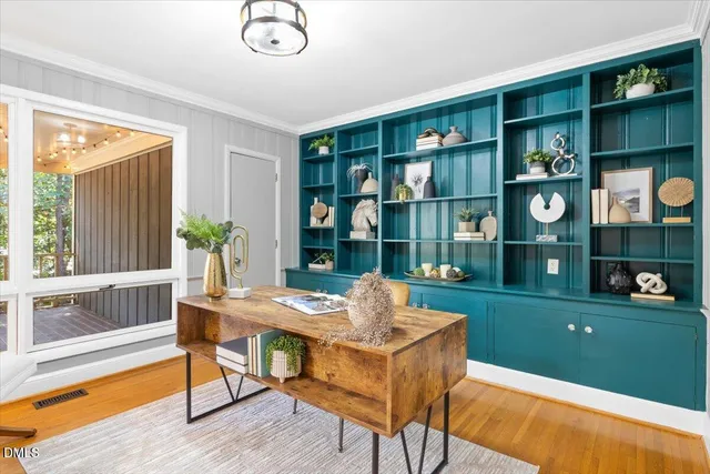 a dining room with furniture and chandelier