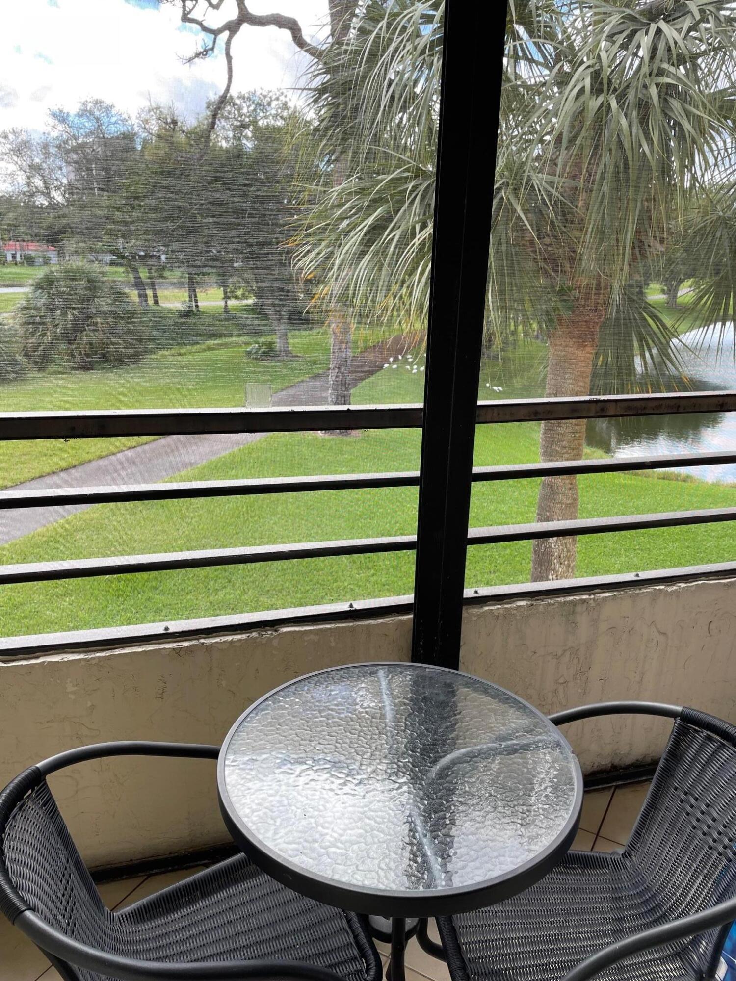 7472 La Paz Boulevard, Unit 205 Boca Raton, FL 33433 - Photo 9 of 14 2nd patio