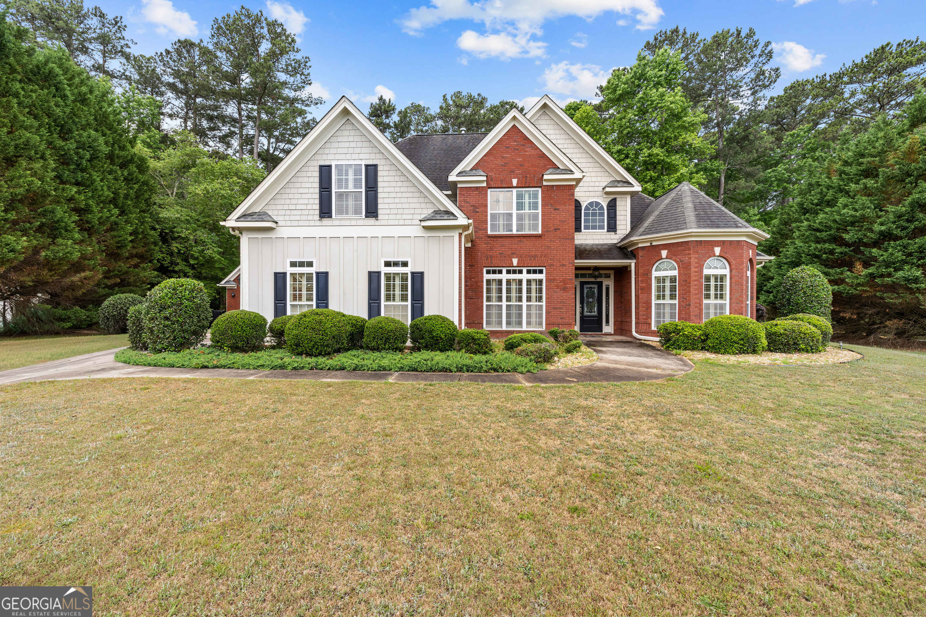 120 Shankhill Ridge Tyrone, GA 30290 - Photo 1 of 54 a front view of a house with a yard and garage