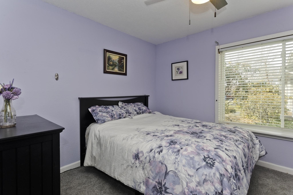 433 Nassau Drive, Unit 433 Springfield, MA 01129 - Photo 33 of 41 a bedroom with a bed and a desk