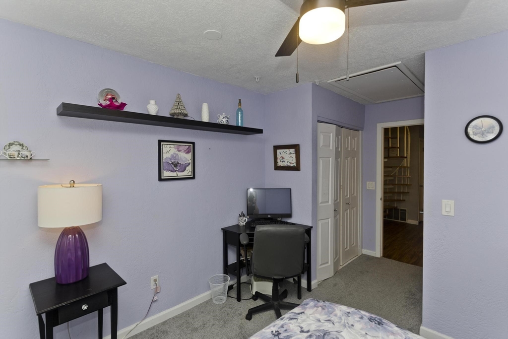 433 Nassau Drive, Unit 433 Springfield, MA 01129 - Photo 36 of 41 a view of a workspace with furniture and a window