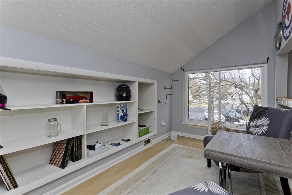 433 Nassau Drive, Unit 433 Springfield, MA 01129 - Photo 38 of 41 a living room with furniture and a flat screen tv
