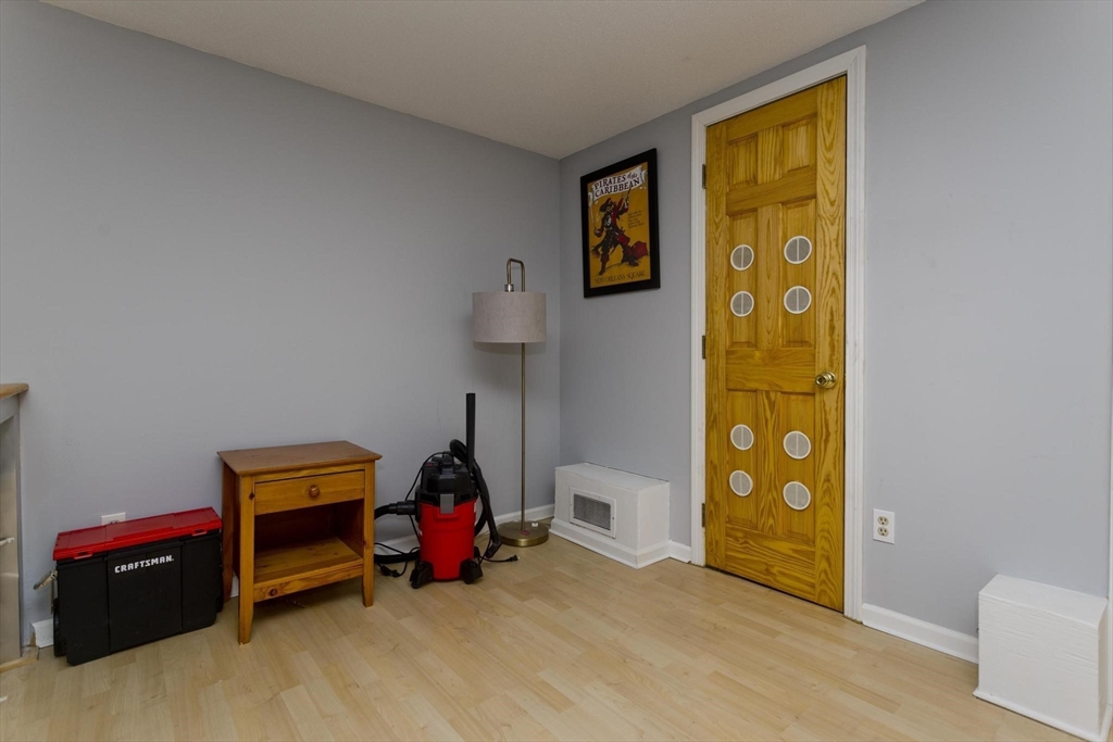 433 Nassau Drive, Unit 433 Springfield, MA 01129 - Photo 39 of 41 a bedroom with a bed and a window