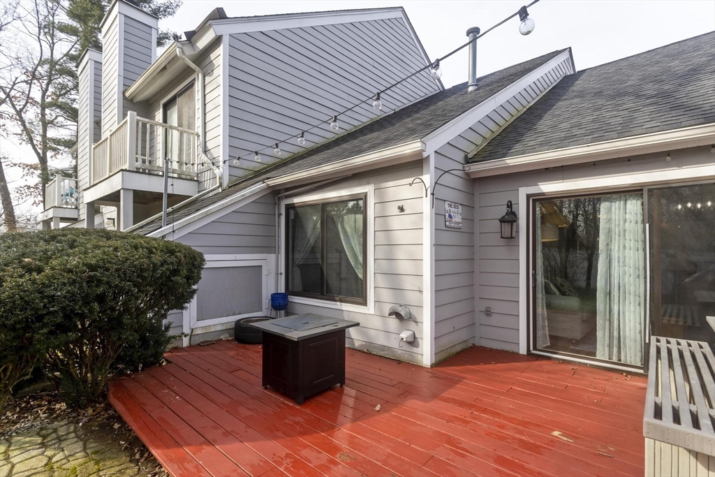 433 Nassau Drive, Unit 433 Springfield, MA 01129 - Photo 5 of 41 a backyard of a house with seating space