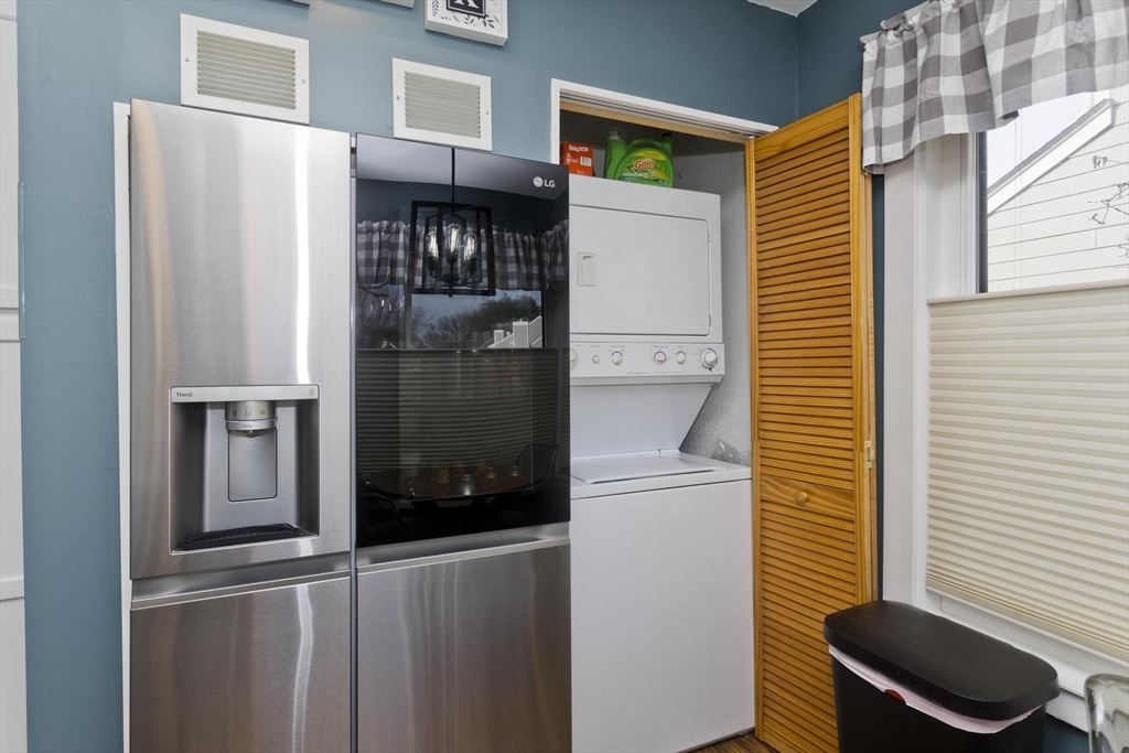 433 Nassau Drive, Unit 433 Springfield, MA 01129 - Photo 7 of 41 a kitchen with a refrigerator and cabinets