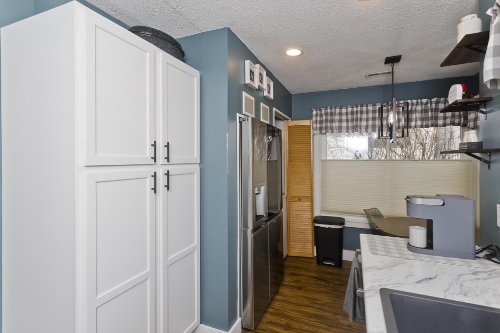 433 Nassau Drive, Unit 433 Springfield, MA 01129 - Photo 9 of 41 a kitchen with stainless steel appliances granite countertop a refrigerator and a sink