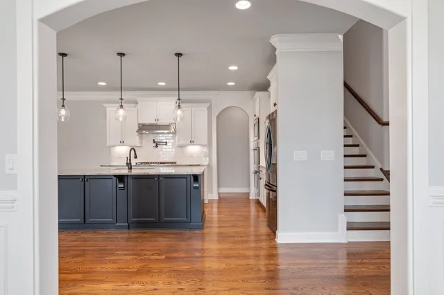 a very nice looking kitchen with a chandelier