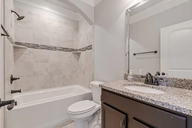 a kitchen with granite countertop a sink stainless steel appliances and cabinets