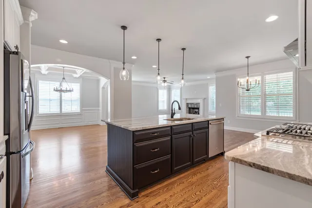 a bathroom with a granite countertop sink double and mirror