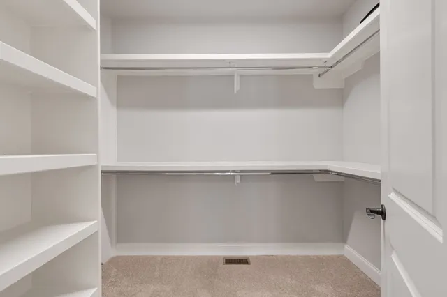 a bathroom with a granite countertop sink mirror toilet and bathtub