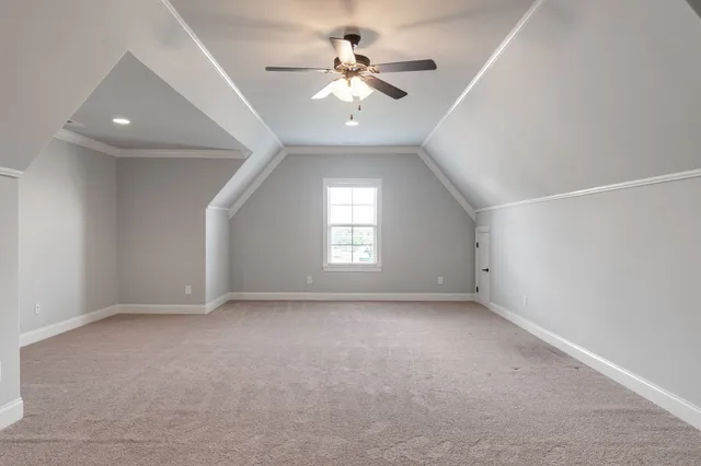 a view of a porch with wooden floor and iron stairs