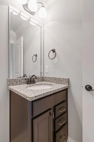 a front view of a house with a garden and porch