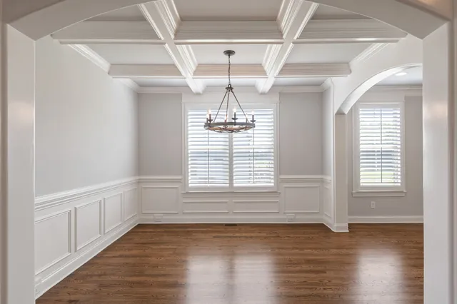 a view of kitchen with sink and wooden floor