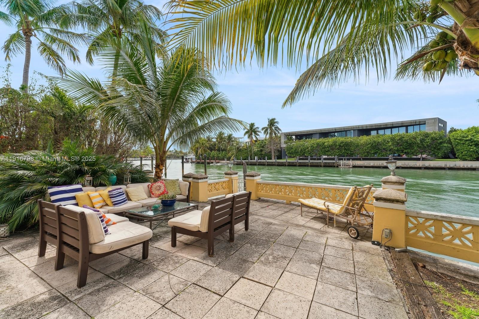 4812 Pine Tree Drive, Unit 206 Miami Beach, FL 33140 - Photo 14 of 14 a backyard of a house with outdoor seating