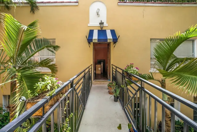 a view of a balcony with wooden floor and stairs