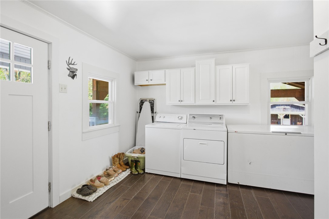 199 Williams Farm Road Westminster, SC 29693 - Photo 16 of 47 Bright and functional, this laundry area provides ample space and storage for all your household needs.