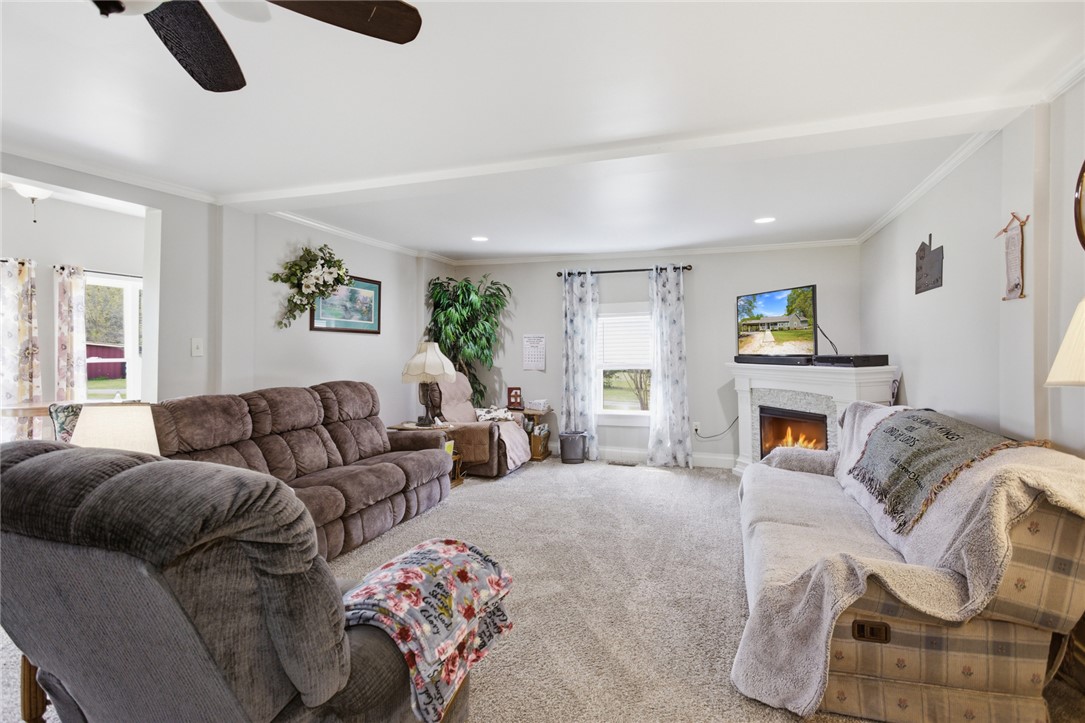 199 Williams Farm Road Westminster, SC 29693 - Photo 2 of 47 This inviting living room features a cozy fireplace and abundant natural light.