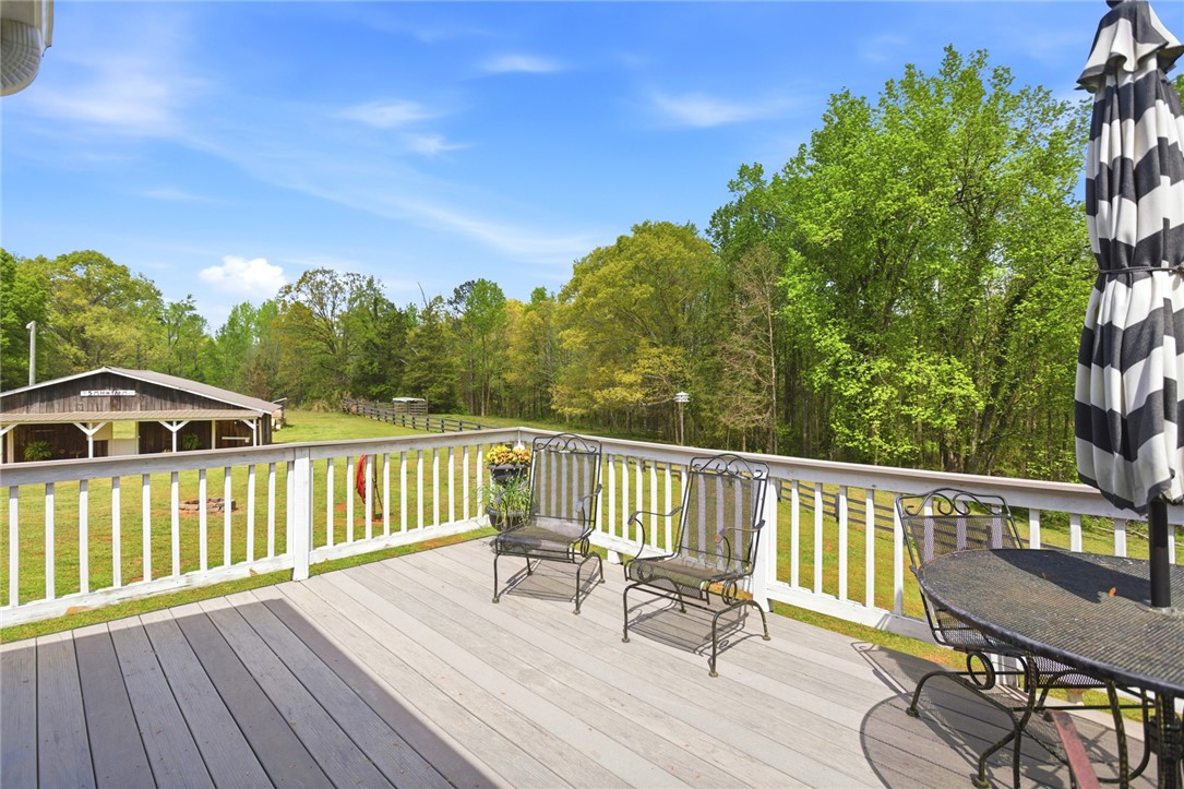 199 Williams Farm Road Westminster, SC 29693 - Photo 22 of 47 Enjoy tranquil views of lush greenery and open skies from this inviting outdoor deck.