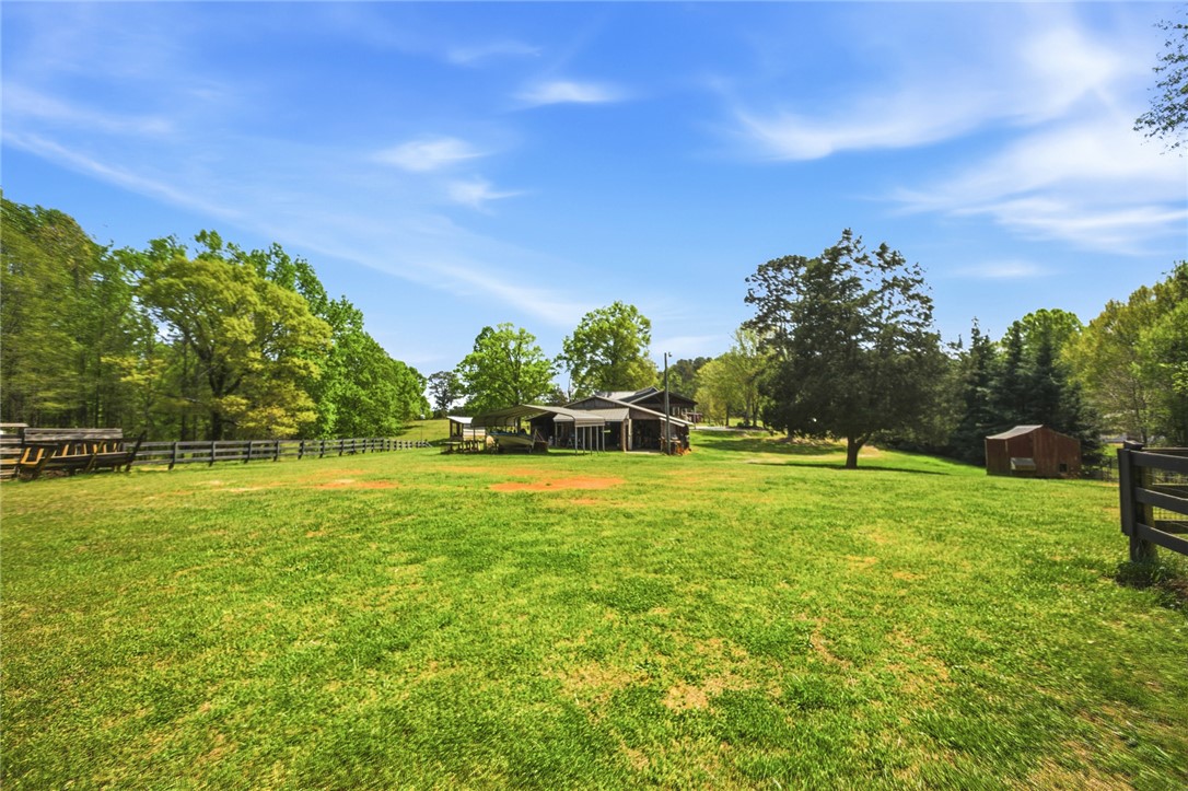 199 Williams Farm Road Westminster, SC 29693 - Photo 34 of 47 Expansive green acreage surrounds a versatile barn, offering pastoral charm and potential.