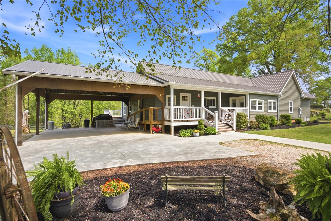 199 Williams Farm Road Westminster, SC 29693 - Photo 36 of 47 This charming home offers a spacious carport and inviting front porch, perfect for outdoor living.