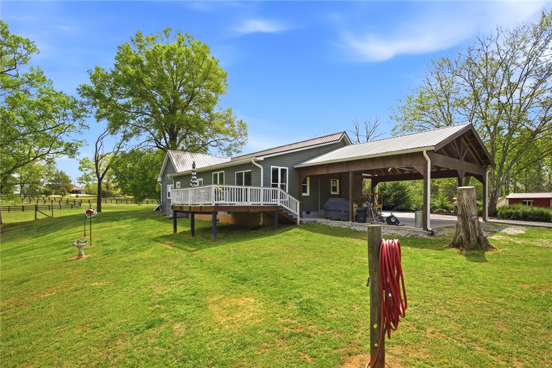 199 Williams Farm Road Westminster, SC 29693 - Photo 37 of 47 This charming home offers a sprawling yard and a covered outdoor living space.
