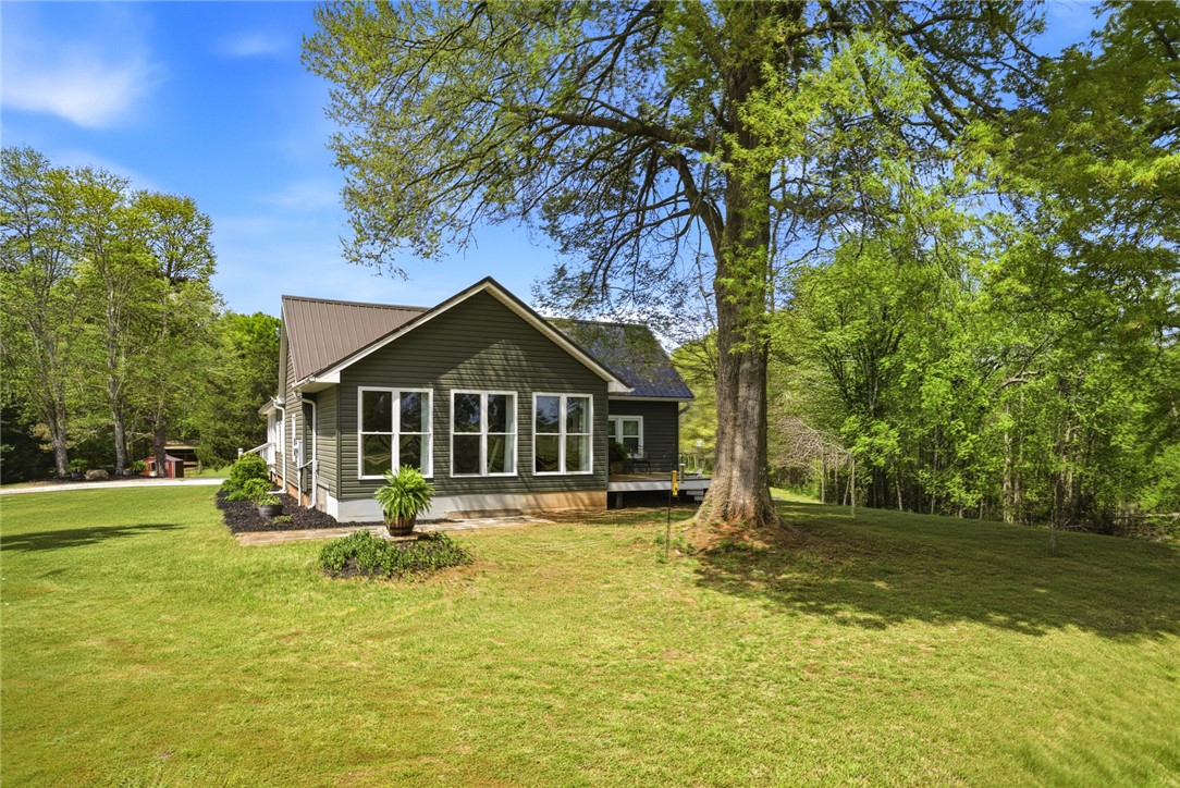 199 Williams Farm Road Westminster, SC 29693 - Photo 39 of 47 This charming home offers a peaceful retreat with abundant green space and mature trees.