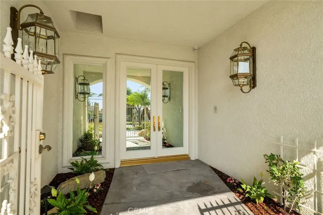 view of a hallway with wooden floor and a dining room