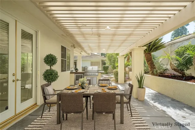 a dining room with furniture and window