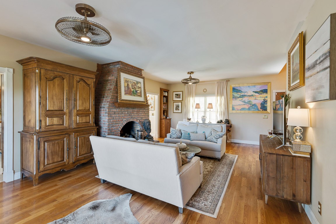 1368 Hunter Road Franklin, TN 37064 - Photo 11 of 45 a living room with furniture wooden floor and a fireplace