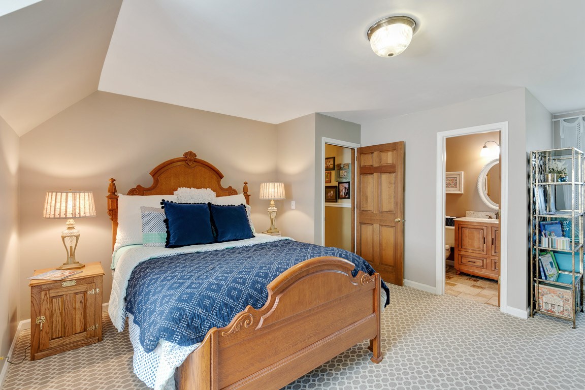 1368 Hunter Road Franklin, TN 37064 - Photo 31 of 45 a bedroom with a large bed and a chandelier