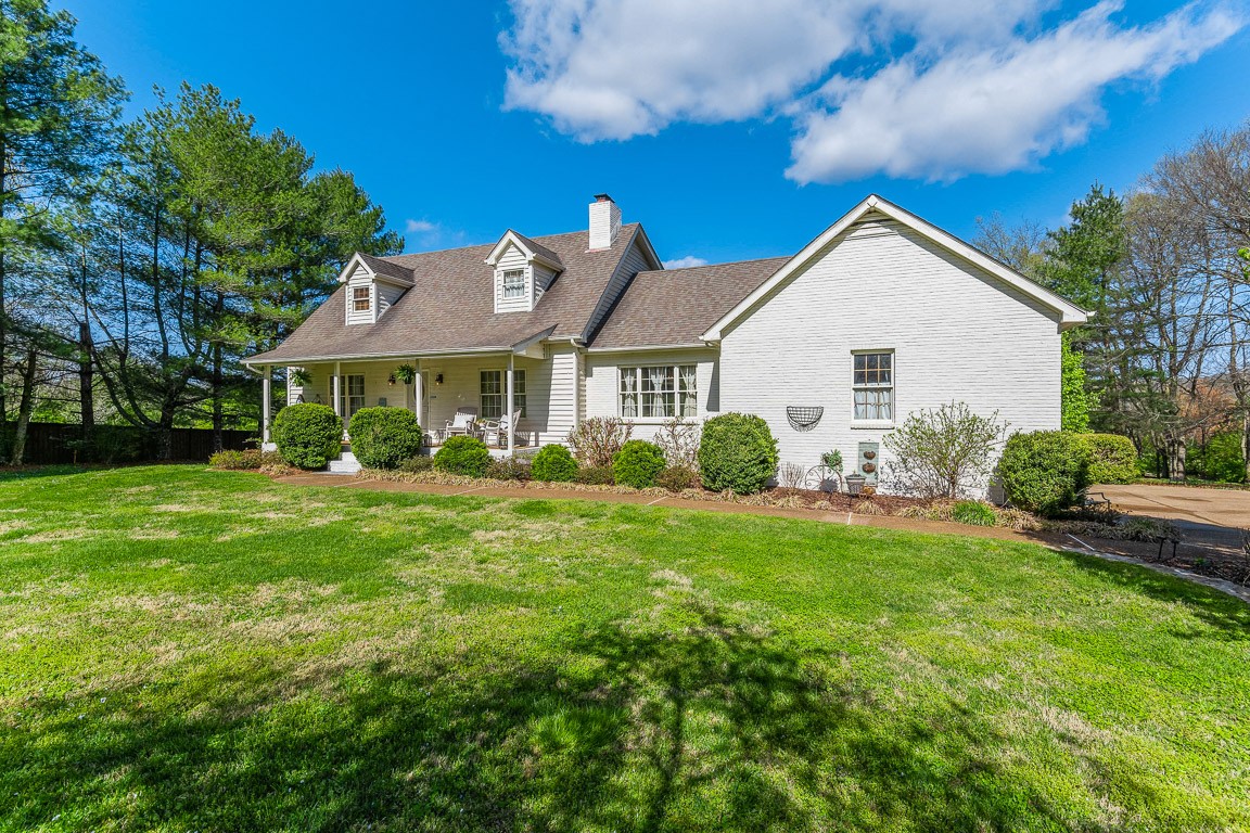 1368 Hunter Road Franklin, TN 37064 - Photo 39 of 45 a view of a house with a big yard potted plants and large tree