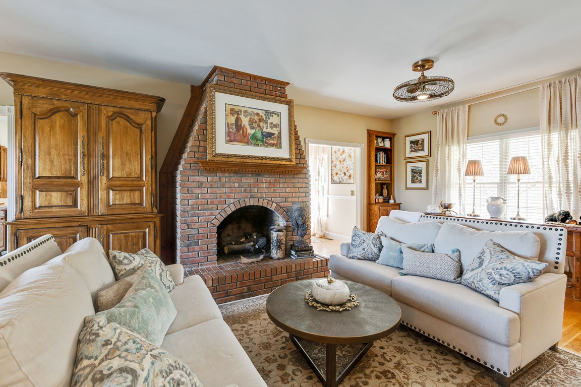 1368 Hunter Road Franklin, TN 37064 - Photo 10 of 45 a living room with furniture a fireplace and a large window