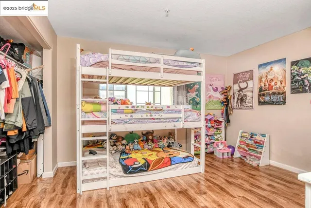 a view of entryway with furniture and wooden floor